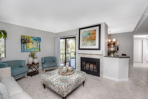 a living room with a fireplace and a couch